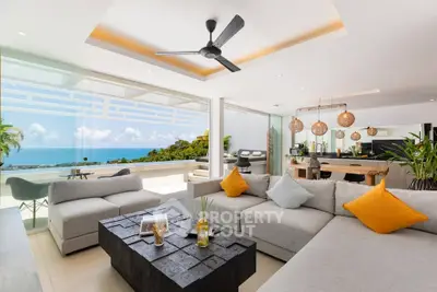 Luxurious open-plan living room with stunning ocean view and modern decor