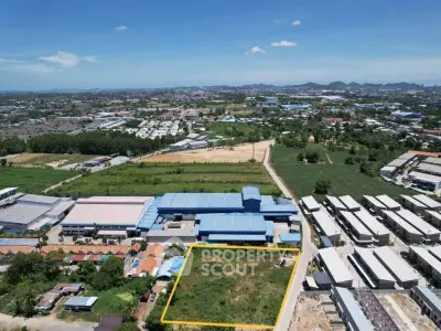Expansive aerial view of industrial land for sale with clear boundaries and potential for development.