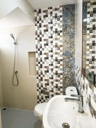 Modern bathroom with stylish tile design and sleek fixtures