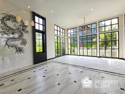 Luxurious spacious living room with elegant marble flooring and stunning dragon wall art