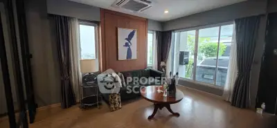 Elegant living room with large windows and stylish decor