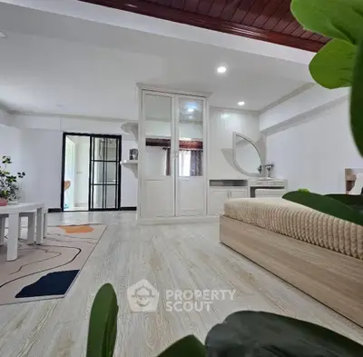 Spacious living room with modern decor and elegant wooden flooring
