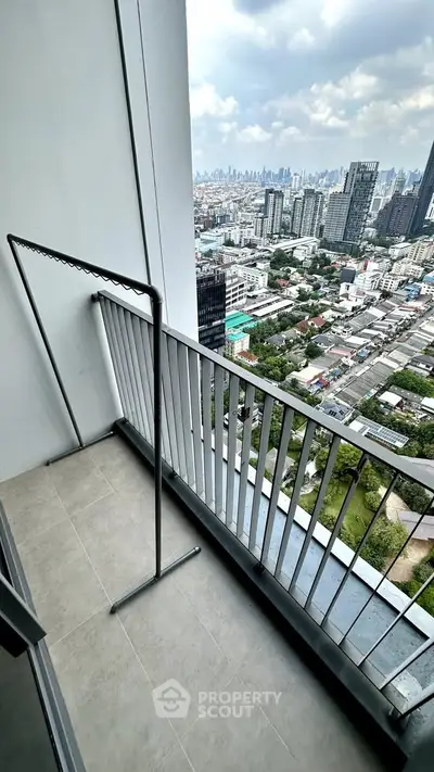 High-rise balcony with stunning cityscape view, perfect for urban living.