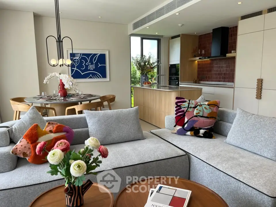 Modern living room with stylish decor and open kitchen layout