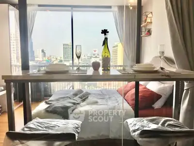 Chic urban bedroom with balcony view and stylish dining setup