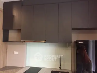 Modern kitchen with sleek cabinets and built-in appliances