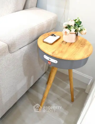 Stylish wooden side table with built-in wireless charger and elegant decor