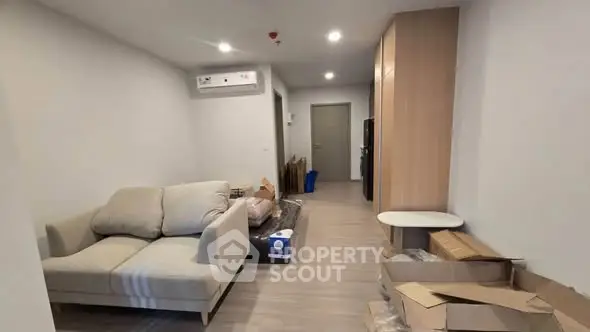 Spacious living room with modern furniture and ample storage space