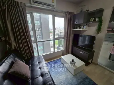 Modern living room with city view, sleek furniture, and natural light