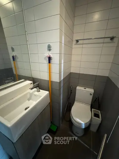 Modern bathroom with sleek fixtures and tiled walls