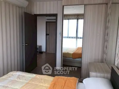 Cozy bedroom with mirrored closet and modern decor