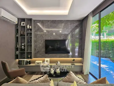Luxurious modern living room with large window and stylish decor