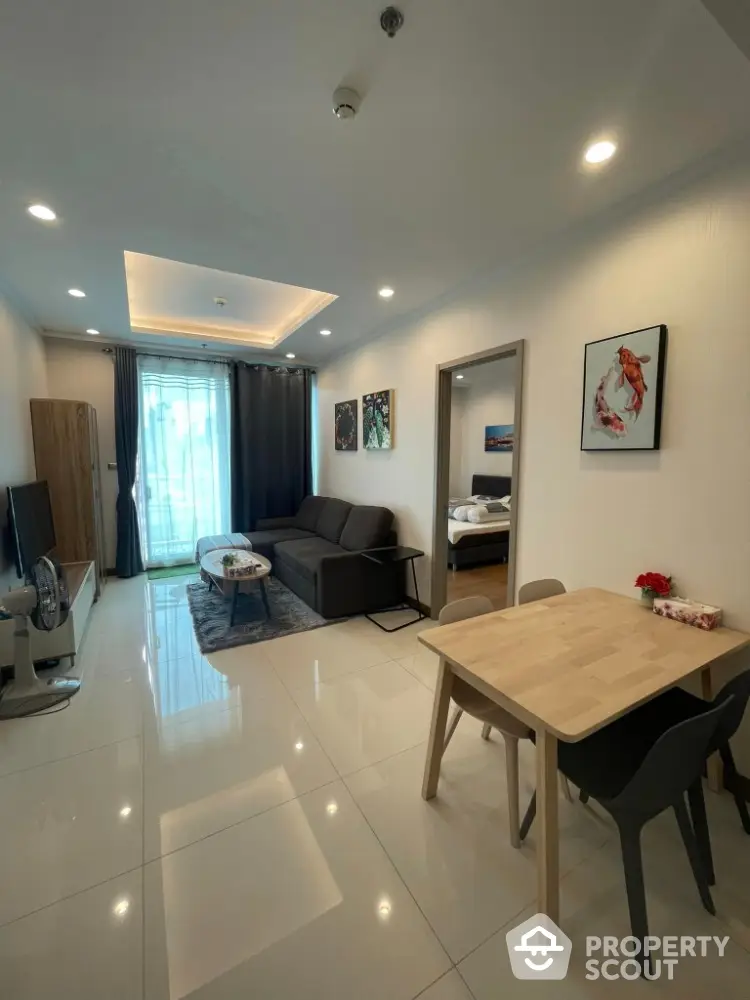 Modern living room with sleek design, open layout, and stylish decor in a contemporary apartment.