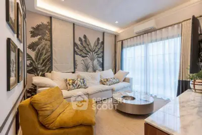 Stylish living room with modern decor, large windows, and cozy seating area.