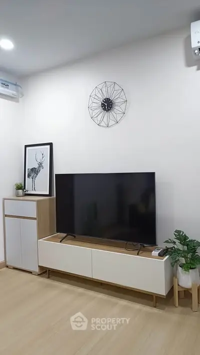 Modern living room with stylish TV setup and minimalist decor