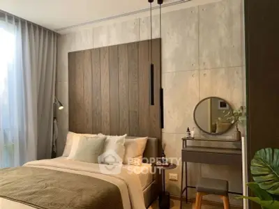 Modern bedroom with stylish decor and natural light