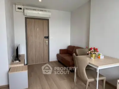 Modern living room with sleek furniture and air conditioning in a cozy apartment.