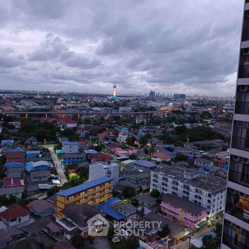 Stunning cityscape view from high-rise building at dusk with vibrant skyline.