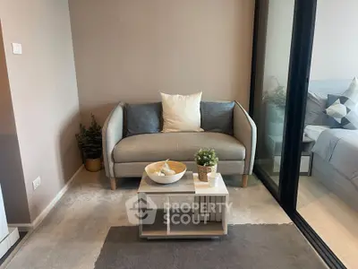 Cozy modern living room with stylish gray sofa and decorative plants