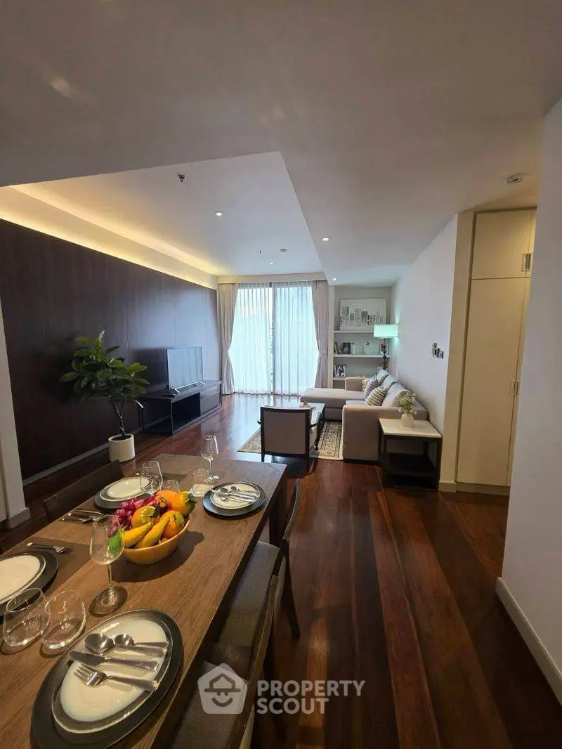 Spacious modern living room with elegant dining area and natural light