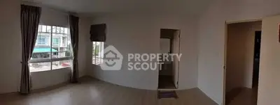 Spacious unfurnished room with large windows and natural light, ideal for customization.