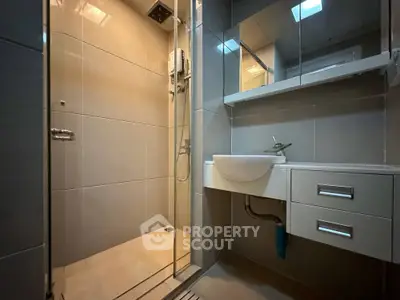 Modern bathroom with sleek design and glass shower enclosure