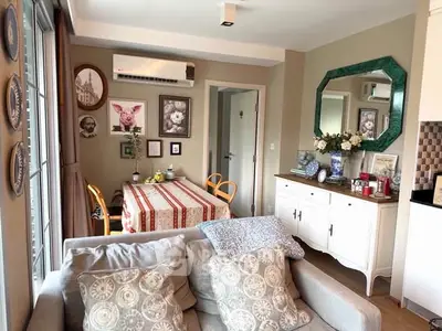 Charming living room with elegant decor and cozy dining area, perfect for stylish urban living.