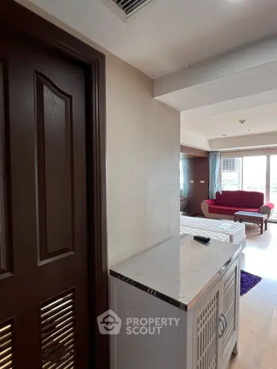 Spacious bedroom with modern decor and natural light