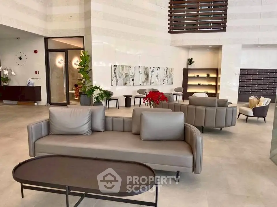 Luxurious modern lobby with elegant seating and stylish decor, perfect for welcoming guests in a sophisticated building.