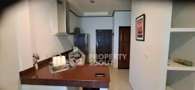 Modern kitchen with sleek countertops and stainless steel appliances