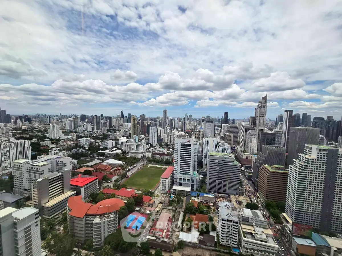 Stunning cityscape view from high-rise building showcasing urban skyline and vibrant city life.