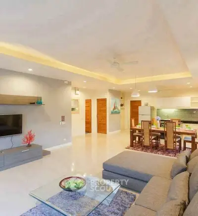 Spacious open-plan living room with modern decor and dining area
