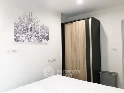 Modern bedroom with stylish wardrobe and elegant wall art