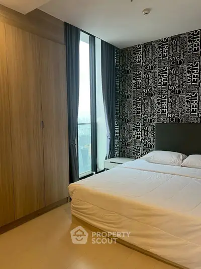 Modern bedroom with NYC-themed wallpaper and large window view