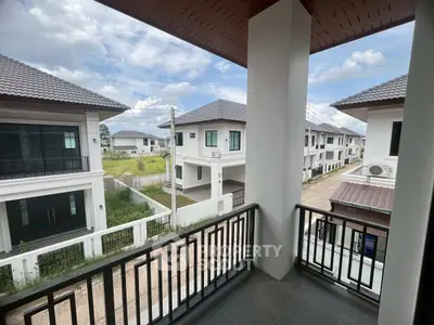 Charming balcony view of modern suburban homes with clear skies