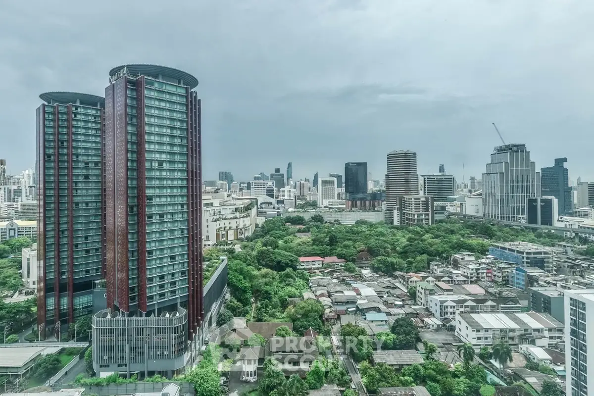Stunning cityscape view with modern high-rise buildings and lush greenery, perfect for urban living enthusiasts.