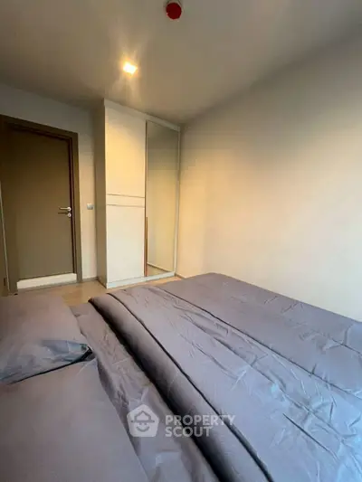 Cozy bedroom with modern decor and ample storage space