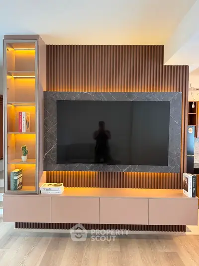 Modern living room with stylish TV wall unit and ambient lighting