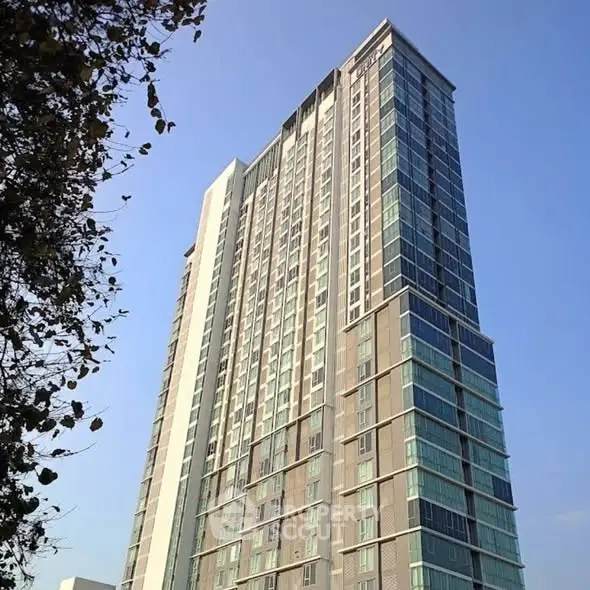 Stunning high-rise building with modern architecture against clear blue sky