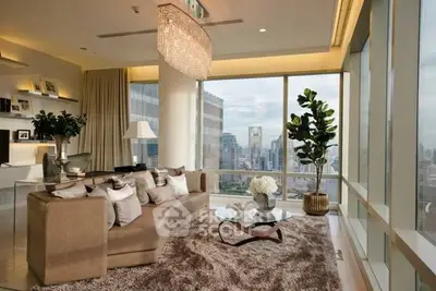 Luxurious living room with stunning city view, elegant decor, and plush furnishings in a high-rise apartment.