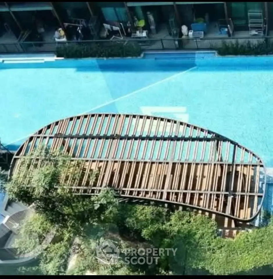 Luxurious rooftop pool with modern architectural design and lush greenery, perfect for relaxation and leisure.