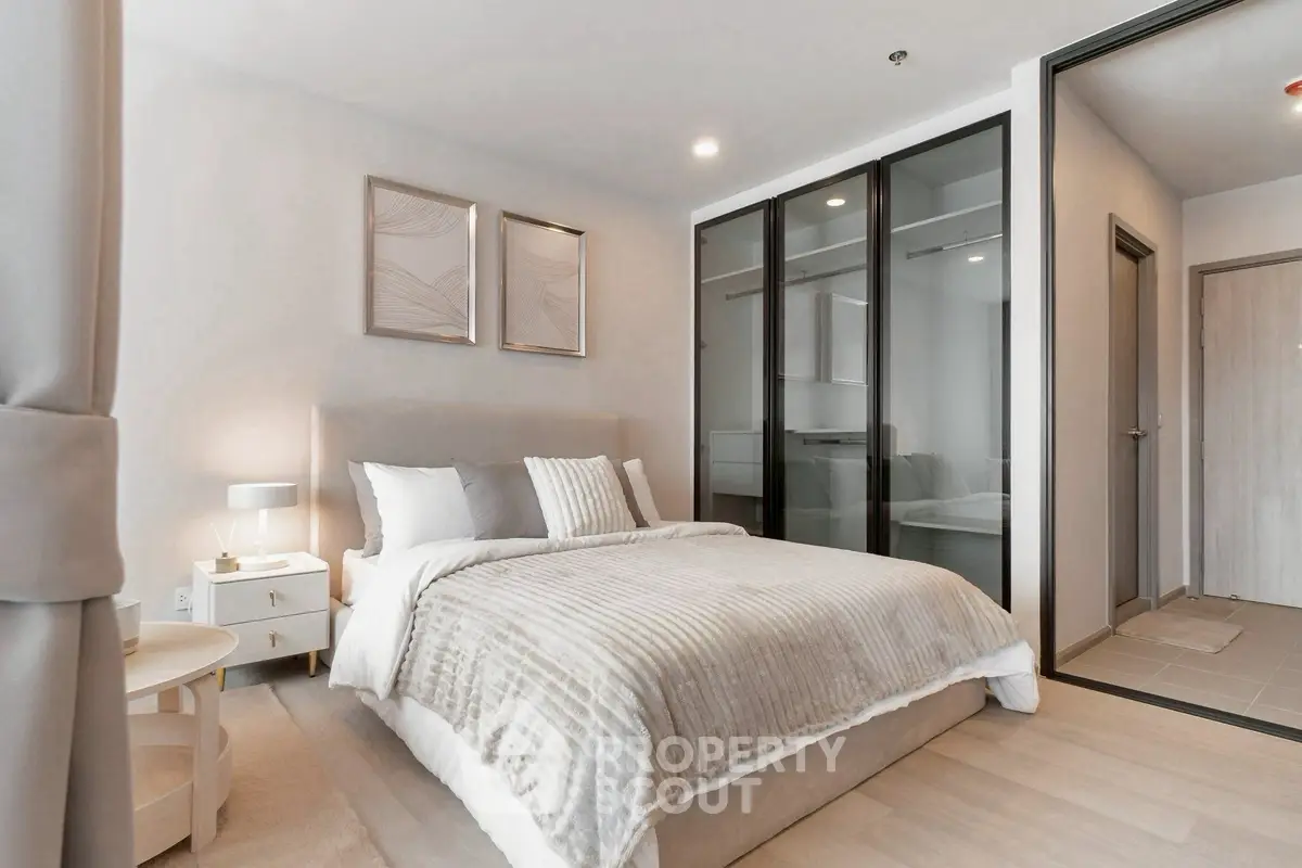 Modern bedroom with elegant decor and spacious walk-in closet