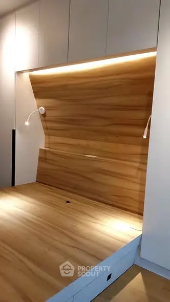 Modern minimalist bedroom with wood paneling and built-in lighting