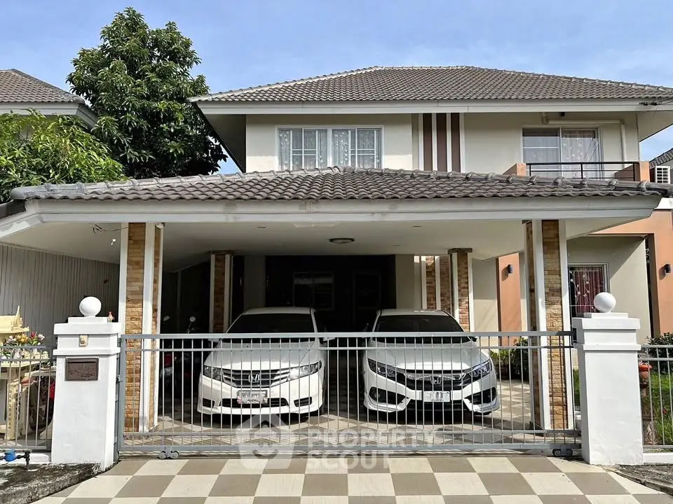 Charming two-story house with spacious driveway and modern design in a serene neighborhood.