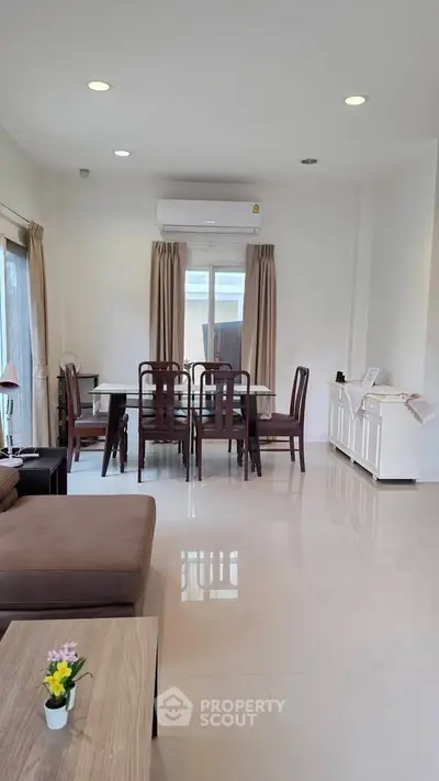Spacious living room with elegant dining area and modern furniture