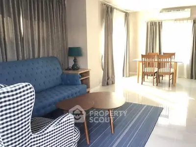 Charming living room with stylish furniture and natural light, perfect for relaxation and entertaining.