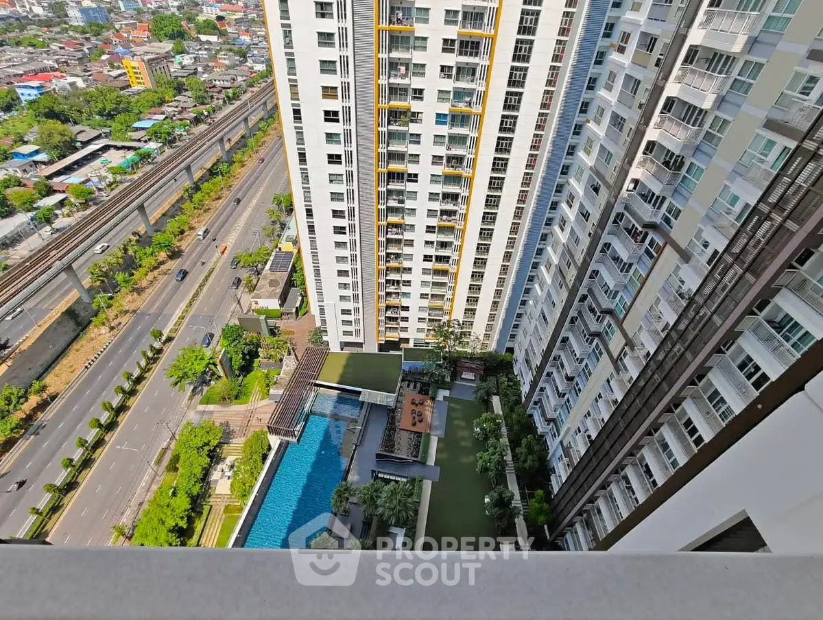 Stunning high-rise building with pool and city view, perfect for urban living.