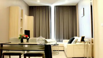 Modern living room with elegant decor and cozy seating area, perfect for relaxation and entertainment.
