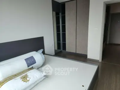 Modern bedroom with sleek design and built-in wardrobe, perfect for stylish living.