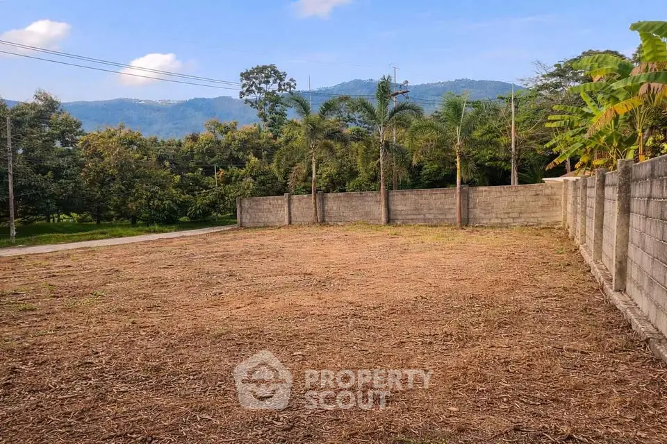 Spacious vacant land with mountain views, ideal for development or investment opportunities.